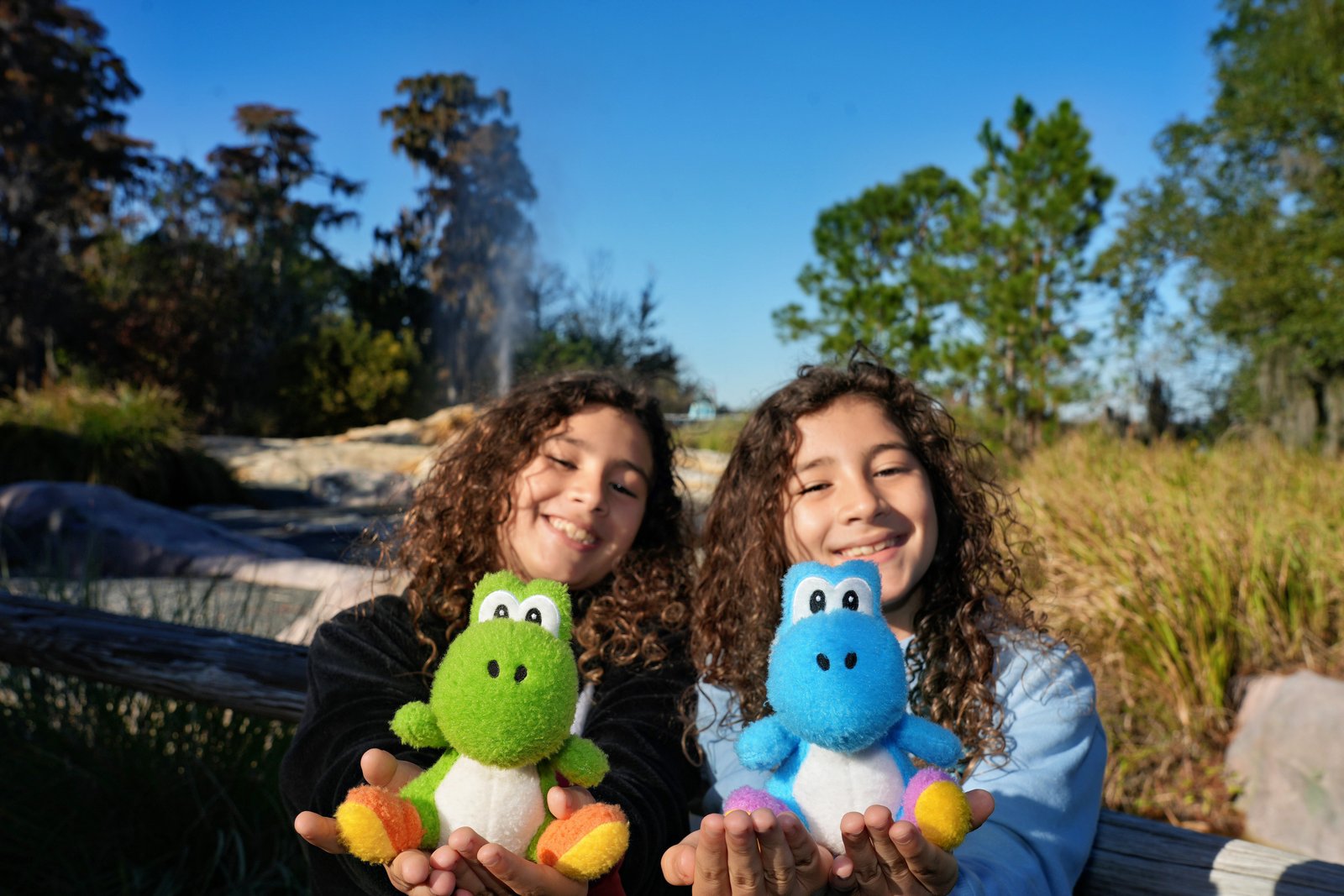 Giovanni and Vincenzo holding Yoshi plushies